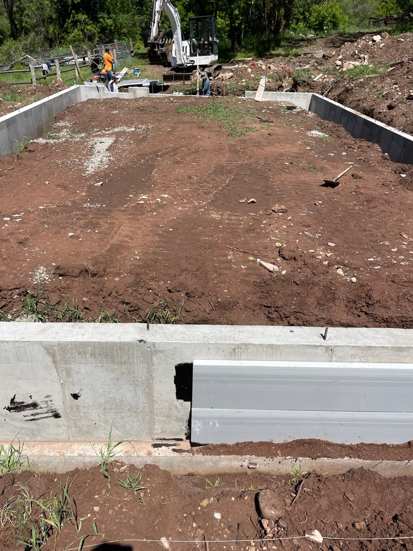 Freshly poured foundation walls, ready for backfill